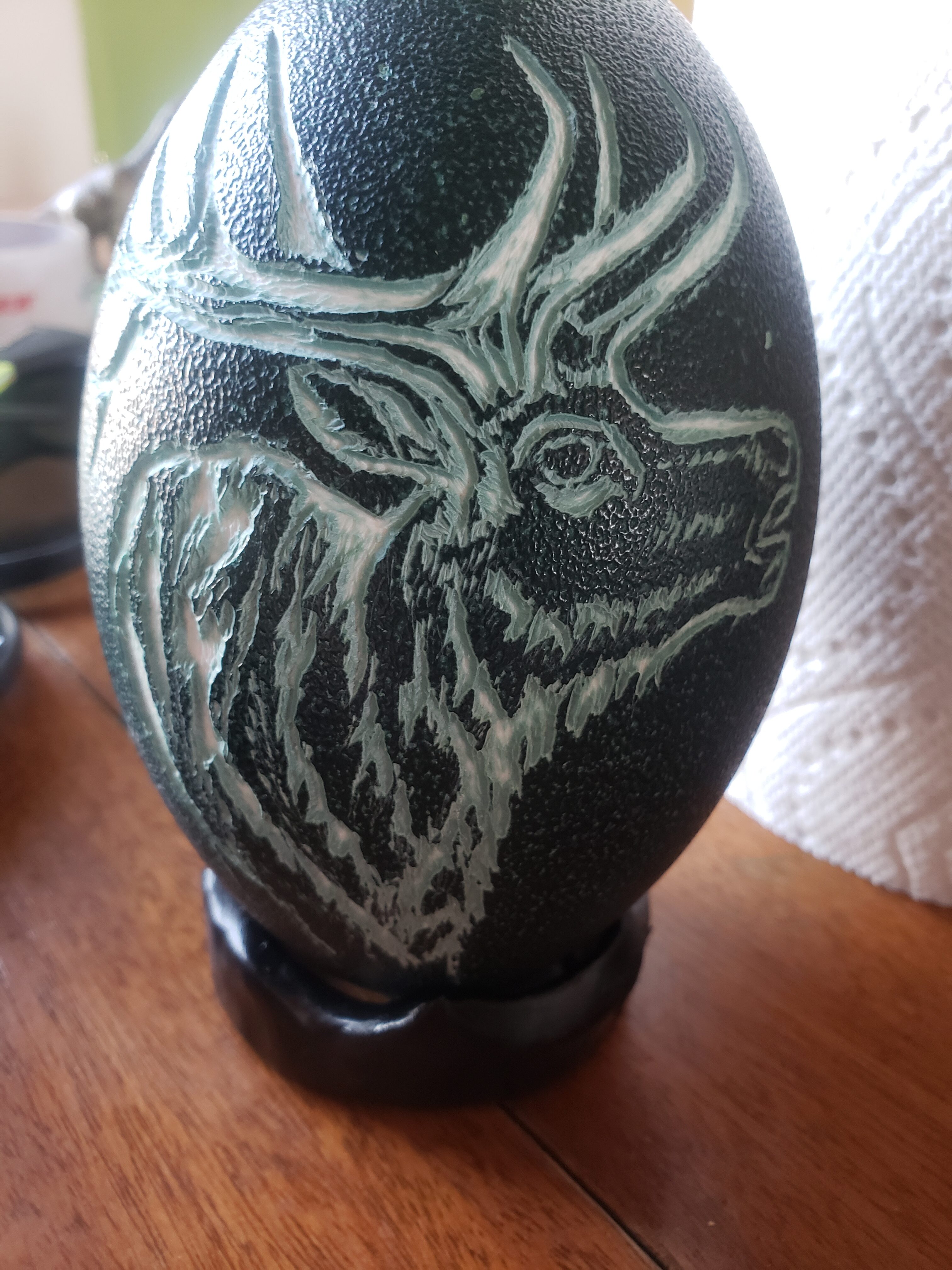 Cinny emu egg with elk carving