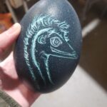 A portrait of Cinny I carved on one of her eggs. Top image shows it lit up